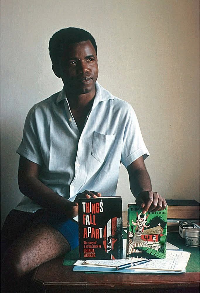 Reverred Nigeria Novelist, Late Chinua Achebe Posses With His Novels In Enugu 1959